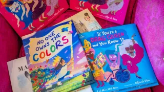 Viral Video of Lesbian Couple Reacting to LGBTQ+ Kids’ Book Section Sparks Debates